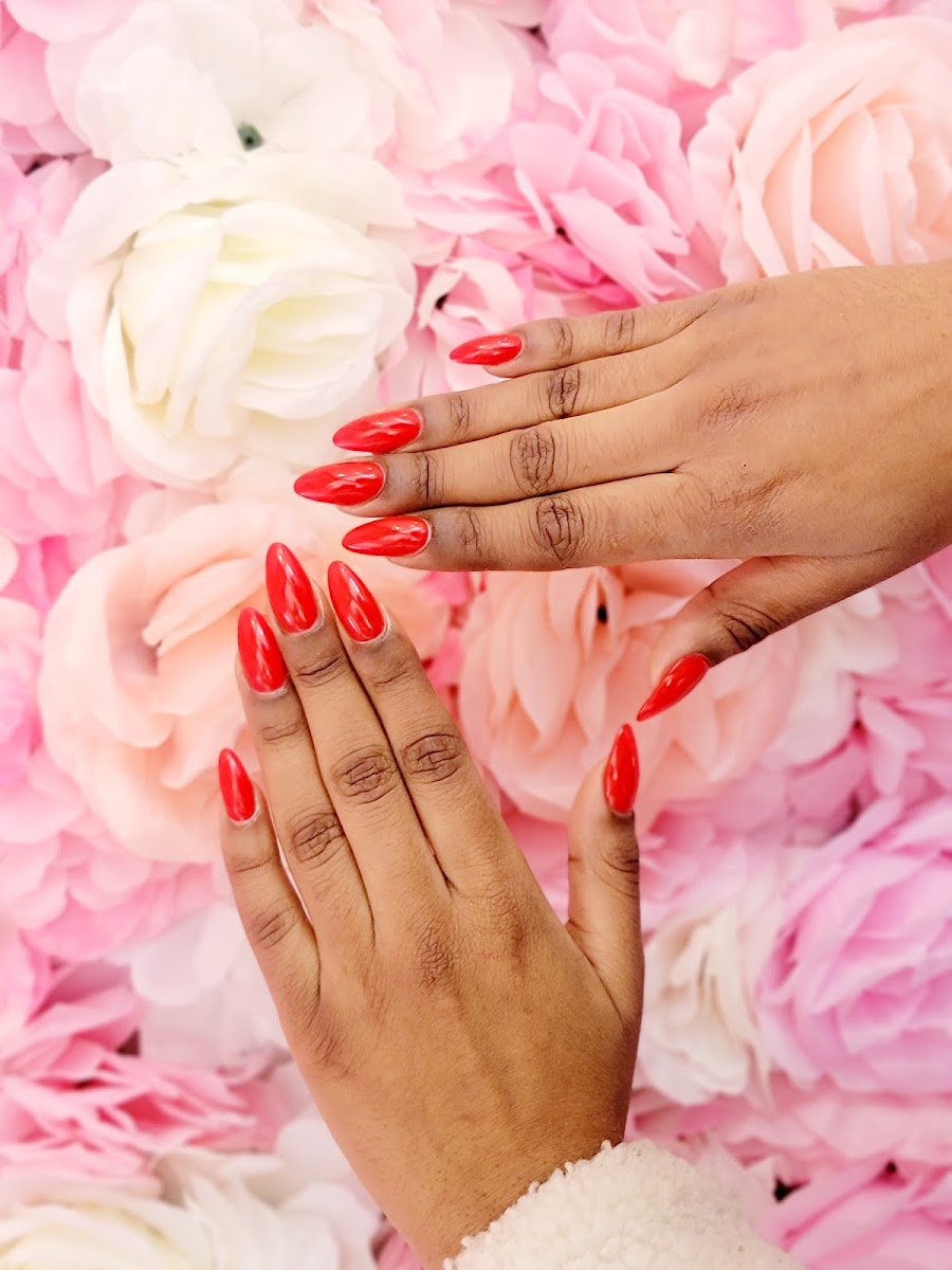 Glossy red almond nails