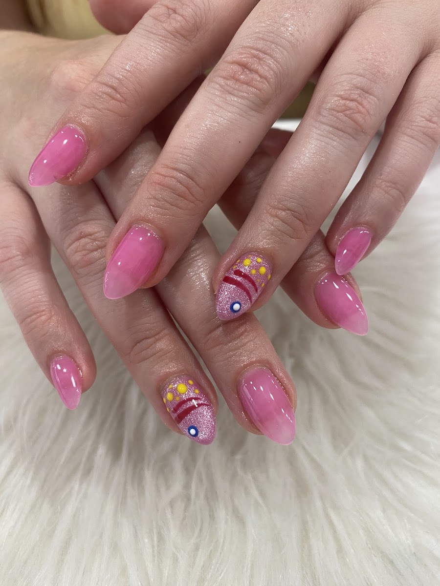 Pink manicure with detailed accent nails